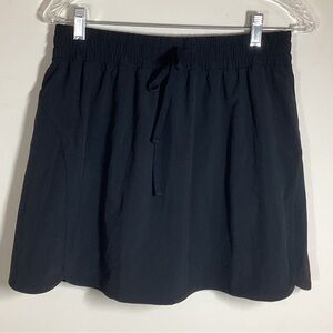 NWOT Beyond Yoga Black Skirt Skort L Pockets Athletic In Stride Shorts